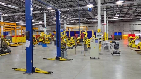 Prototype automotive assembly facility floor before auction of factory assets Stock Footage 316879454
