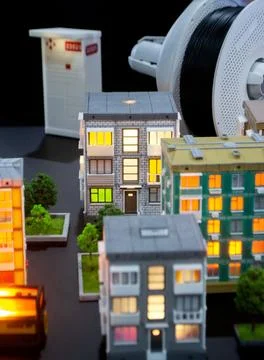 Prototype building printed on 3D printer from melted plastic 3D-printed building Fotos de archivo