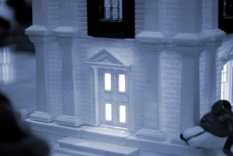 Prototype printed on 3D printer brick building with columns and glowing windows Fotos de archivo