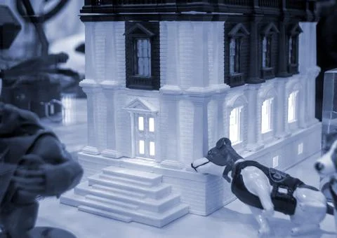 Prototype printed on 3D printer brick building with columns and glowing windows Fotos de archivo