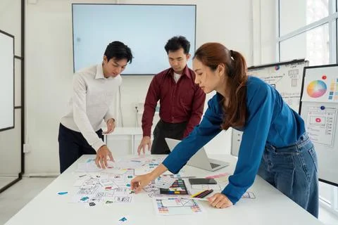 Prototyping and User-Centric Approach. Professionals creating mockups for Stock Photos