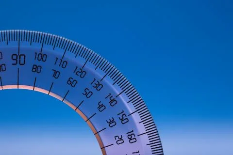 Protractor on blue Stock Photos