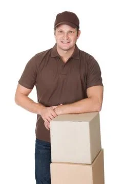 Protrait of delivery man with stack of boxes Stock Photos