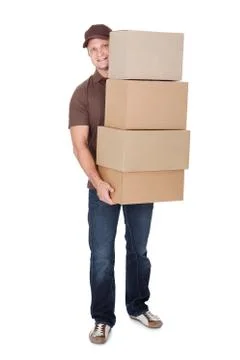 Protrait of delivery man with stack of boxes Stockfoto's