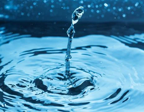 Protuberance splash above surface of water Stock Photos