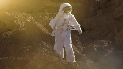 Proud Astronaut on Mars Surface. Red Planet Covered in Gas and rock Stock Footage 111216895