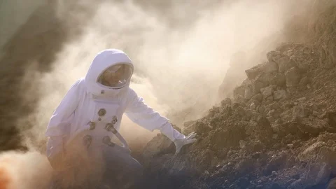 Proud Astronaut on Mars Surface. Red Planet Covered in Gas and rock Stock Footage 111217111