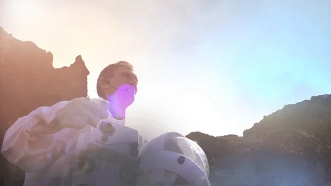 Proud Astronaut on Mars Surface. Red Planet Covered in Gas and rock Stock Footage 111217214