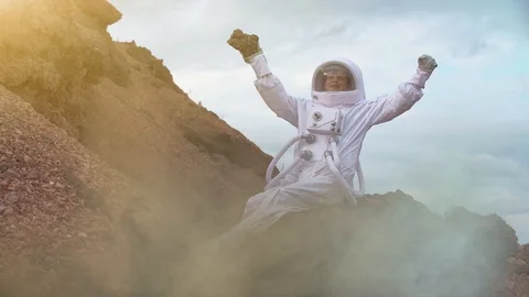 Proud Astronaut on Mars Surface. Red Planet covered rock Stock Footage 111373291