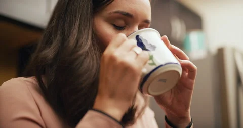 Proud corporate office worker really enjoys drinking her coffee in office kitche Stock Footage 199458469