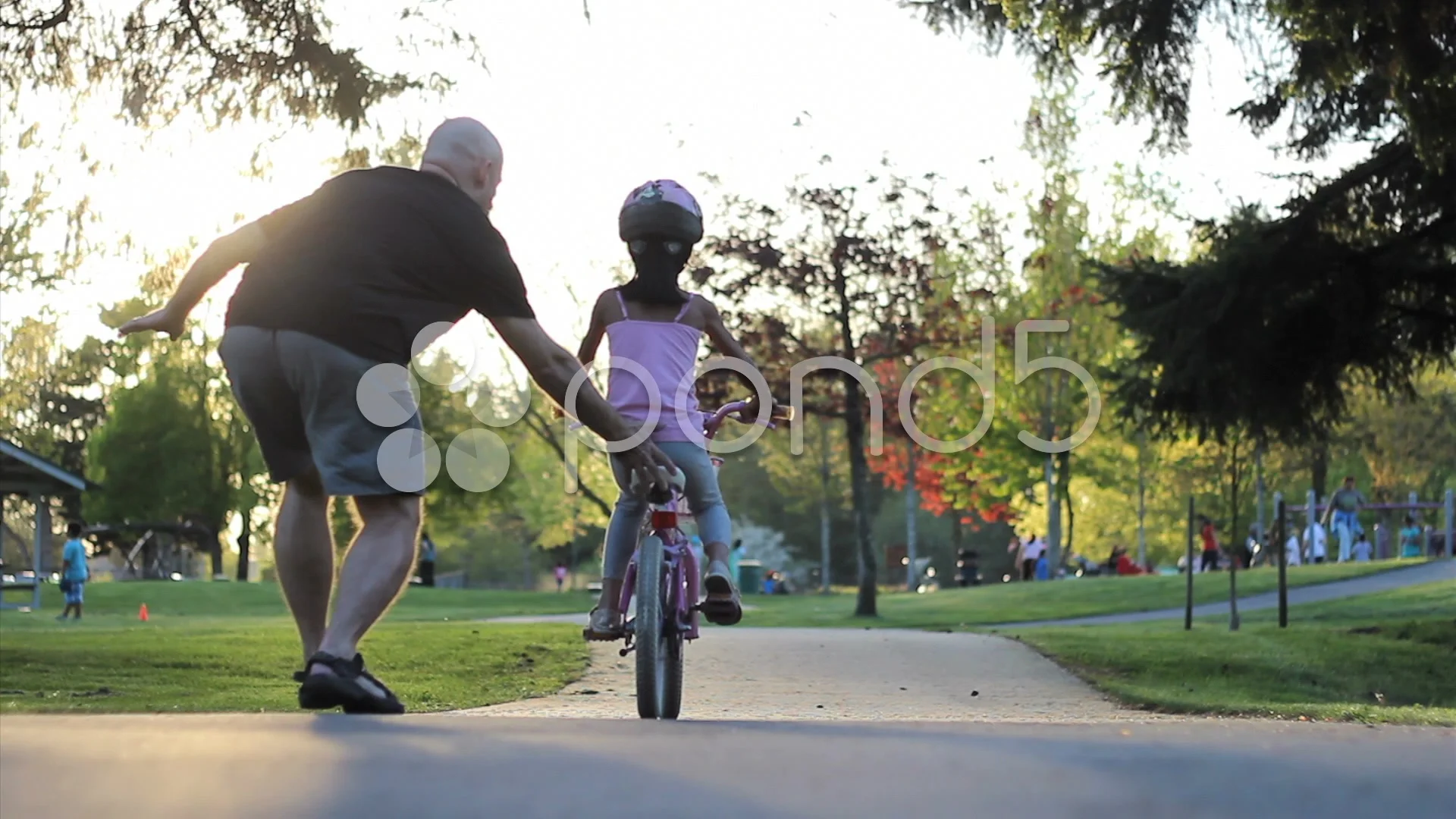 Proud Dad Helps Daughter Ride Her New Bike