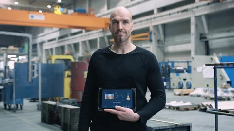 Proud Engineer showing custom app for business use Stock Footage 132704107