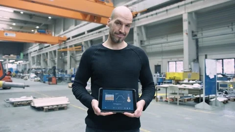 Proud Engineer showing custom app for business use Stock Footage 132704537