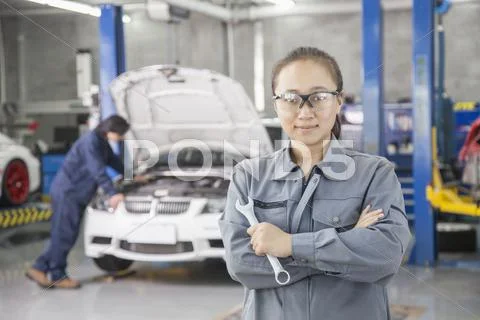 Proud Female Mechanic with Colleague Stock Photos