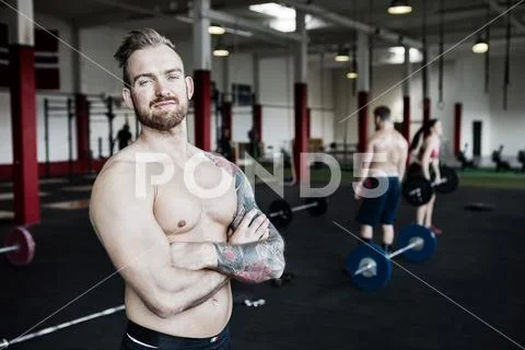 Proud Man Standing Arms Crossed In Gym Stock Photos