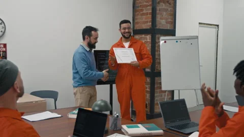 Proud Middle Eastern Convict Receiving Course Certificate from Teacher in Jail Video stock 314055668