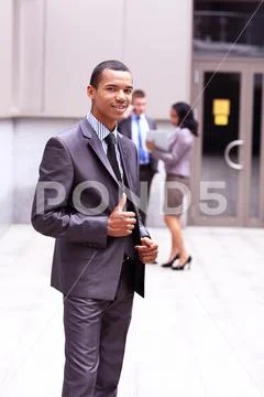 Proud young African business entrepreneur smiling Stock Photos