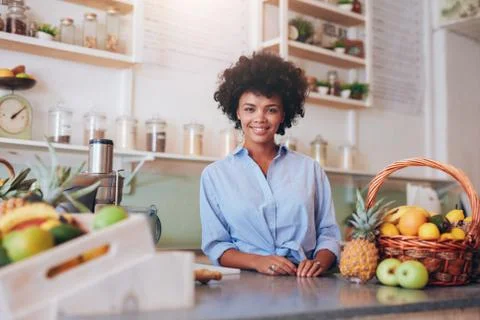 Proud young female juice bar owner Stock Photos