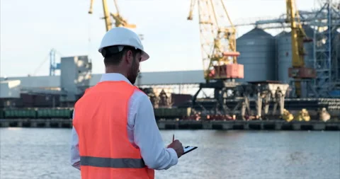 Proud young worker in protective work wear in a shipping yard,Chicago Video stock 148411005