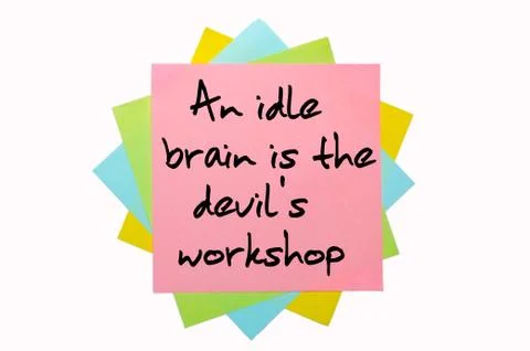 Proverb "an idle brain is the devil's workshop" written on bunch of sticky no Stock Photos