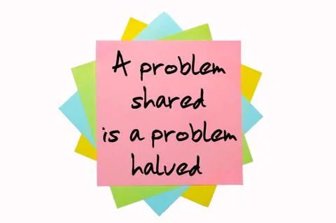 Proverb "a problem shared is a problem halved" written on bunch of sticky not 스톡 사진