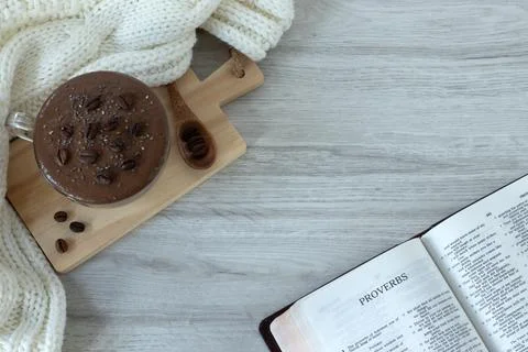 Proverbs open Holy Bible Book on wooden table with cup of coffee, top view Stock Photos