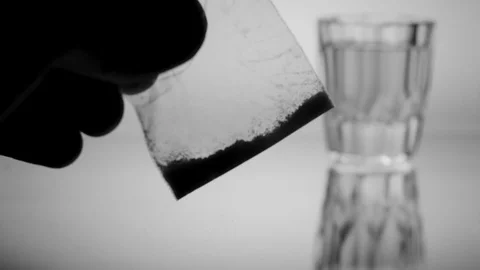 Provider checking white powder,  industry, drugs silhouette  shotglass Stock Footage 87796929