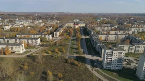 Provincial autumn city with soviet panel houses, alley and house of culture Stock Footage 154243702