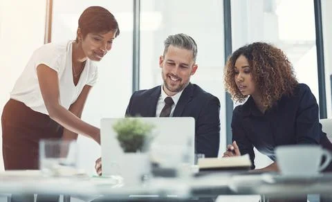 Proving her commitment to their success. a group of businesspeople having a 写真素材