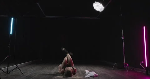 Provocative woman dancing sensually in dance studio. Young blonde dancer moving Stock Footage 259572547