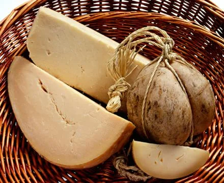 Provolone cheese in a basket Stock Photos