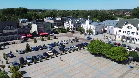 Proximity flight over John Paul II City Square, Ciechanow, Poland, overlooking Stock Footage 301505425