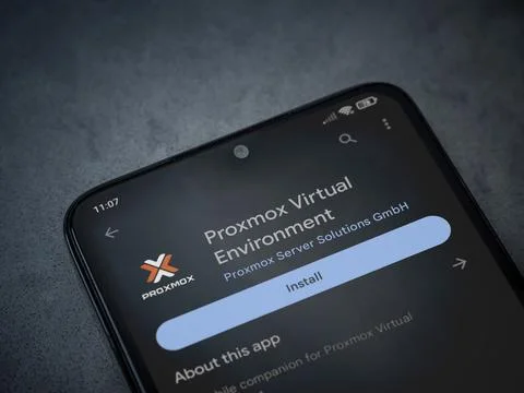 Proxmox Virtual Environment app play store page on smartphone on a dark mar.. Stock Photos