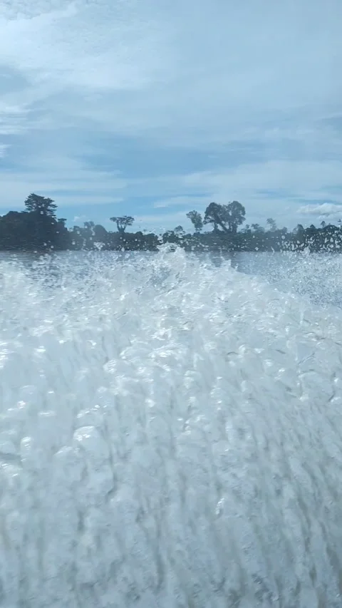 Proyek 04-07 4K jets of water from a speed boat on the Borneo river Stock Footage 237740374