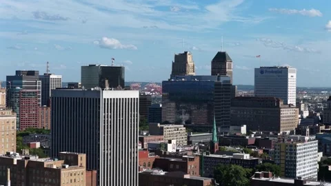 Prudential logo marks glass office tower rising among downtown high-rises Stock Footage 340139329