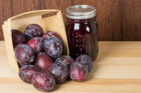 Prune plums with jar of jam Stock Photos