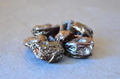 Prunes on a black background Stock Photos