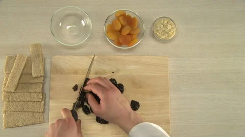 Prunes cutting for a cake. Stock Footage 66671044