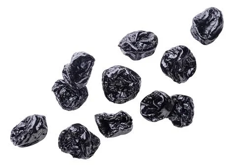 Prunes fly close-up on a white background. Stock Photos