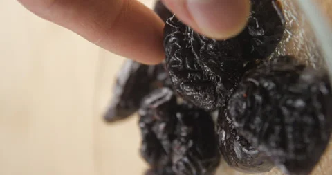 Prunes in plate serving, vertical 4K Stock Footage 263686528