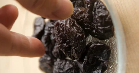 Prunes in plate serving, vertical 4K Video stock 263686557