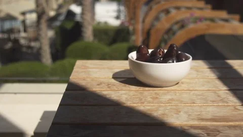 Prunes on the wood table Stock Footage 74920324