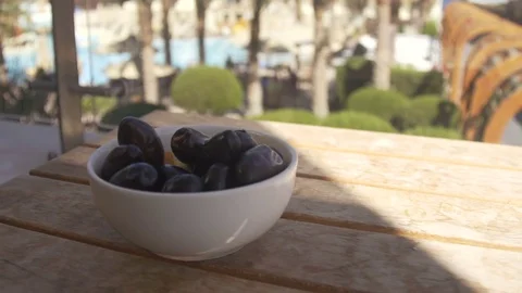 Prunes on the wood table Stock Footage 74920881