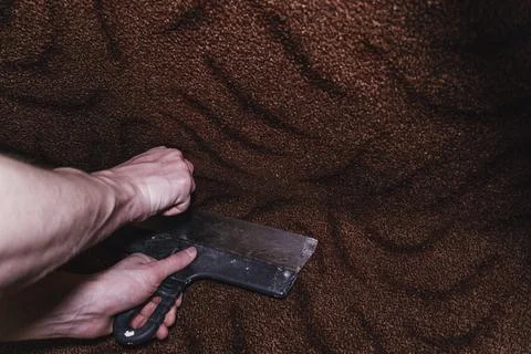 Pruning cutting carpet construction work laying floor sharp blade knife 库存照片