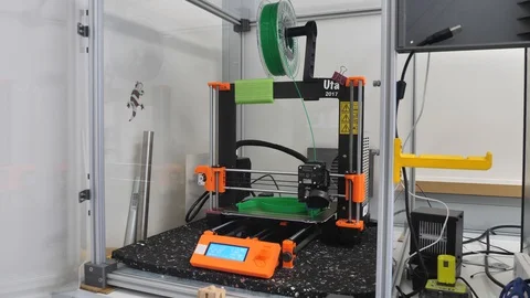 PRUSA MK3 3D Printer at work printing with green plastic filament Video stock 127714198