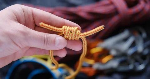 Prusik loop used as autoblock in climbing: close up showing the double fisherman Stock Footage 126059439