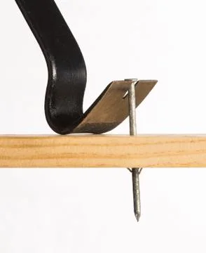 A pry bar removing a nail Stock Photos