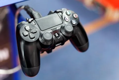PS4 controller closeup, shallow depth of field. PlayStation 4 pad Stock Photos