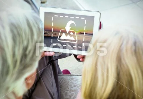 PSD template of active senior couple using digital tablet on sofa at home PSD 템플릿