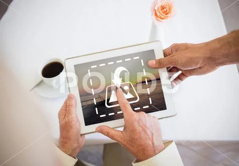 PSD template of Active senior man discussing over digital tablet at table Modello PSD